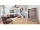 Bright living room with leather sofa and tile floors at 4076 E Tyson St, Gilbert, AZ 85295