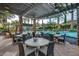 Relaxing pool area with tables and chairs under a shaded pergola at 726 E Citrus Hollow Way, Queen Creek, AZ 85140