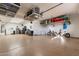 Garage with overhead storage and epoxy floor at 726 E Citrus Hollow Way, Queen Creek, AZ 85140