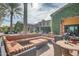 Comfortable outdoor sectional sofa and chairs on a brick patio at 726 E Citrus Hollow Way, Queen Creek, AZ 85140