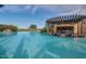 Large resort-style pool with swim-up bar and pergola at 726 E Citrus Hollow Way, Queen Creek, AZ 85140