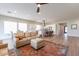 Open concept living room and kitchen area with hardwood floors at 726 E Citrus Hollow Way, Queen Creek, AZ 85140