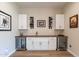 Built-in wet bar with wine storage and quartz countertop at 726 E Citrus Hollow Way, Queen Creek, AZ 85140