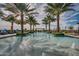 Resort-style pool with lounge chairs and palm trees at 726 E Citrus Hollow Way, Queen Creek, AZ 85140