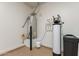 Utility room with water softener and water heater at 726 E Citrus Hollow Way, Queen Creek, AZ 85140