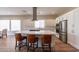 Modern kitchen with white cabinets and a large island at 726 E Citrus Hollow Way, Queen Creek, AZ 85140