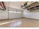 Garage with overhead storage and epoxy floor at 726 E Citrus Hollow Way, Queen Creek, AZ 85140