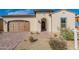 Beautiful curb appeal with a welcoming front porch at 726 E Citrus Hollow Way, Queen Creek, AZ 85140