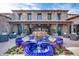 Elegant fountain with blue tile accents in a courtyard at 726 E Citrus Hollow Way, Queen Creek, AZ 85140