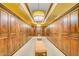 Long hallway with rows of wood lockers and benches at 726 E Citrus Hollow Way, Queen Creek, AZ 85140