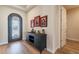 Elegant entryway with decorative console table and artwork at 726 E Citrus Hollow Way, Queen Creek, AZ 85140