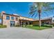 Exterior view of clubhouse with stone facade and palm trees at 726 E Citrus Hollow Way, Queen Creek, AZ 85140