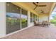 Covered patio with brick pavers and seating at 726 E Citrus Hollow Way, Queen Creek, AZ 85140