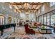Spacious lobby with high ceilings, stone accents, and a grand piano at 726 E Citrus Hollow Way, Queen Creek, AZ 85140