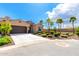 Tan home with a two-car garage and desert landscaping at 16953 W Merrell St, Goodyear, AZ 85395