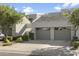 Attractive exterior of a townhome with a two-car garage at 7700 E Gainey Ranch Rd # 206, Scottsdale, AZ 85258