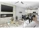 Open living area with a stone fireplace, TV, and comfortable seating at 7700 E Gainey Ranch Rd # 206, Scottsdale, AZ 85258