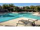 Community pool with lounge chairs and ample space for relaxation at 7700 E Gainey Ranch Rd # 206, Scottsdale, AZ 85258