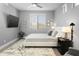 Bright bedroom with a comfortable bed and large window at 7700 E Gainey Ranch Rd # 206, Scottsdale, AZ 85258