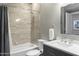 Modern bathroom with a bathtub, shower, and updated vanity at 7700 E Gainey Ranch Rd # 206, Scottsdale, AZ 85258