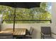 Private balcony with table and chairs, perfect for relaxing at 7700 E Gainey Ranch Rd # 206, Scottsdale, AZ 85258