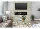 Living room features a modern fireplace and built-in media console at 7700 E Gainey Ranch Rd # 206, Scottsdale, AZ 85258