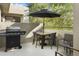 Private balcony with dining furniture and a grill at 7700 E Gainey Ranch Rd # 206, Scottsdale, AZ 85258