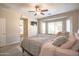 Large main bedroom with bay window and ceiling fan at 5222 W Buckskin Trl, Phoenix, AZ 85083