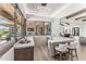 Indoor bar with quartz countertop, custom cabinetry, and views to the backyard at 36931 N 102Nd Pl, Scottsdale, AZ 85262