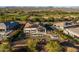 Aerial view of a house with a solar panel system and a large backyard at 17427 E Desert Vista Trl, Rio Verde, AZ 85263