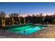 Relaxing pool area with night lighting and a tranquil atmosphere at 17427 E Desert Vista Trl, Rio Verde, AZ 85263