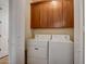 Convenient laundry room with washer, dryer, and upper cabinets at 34457 N Legend Trail Pkwy # 2009, Scottsdale, AZ 85262