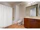 Clean bathroom, featuring a tiled floor, bathtub, and wood vanity at 34457 N Legend Trail Pkwy # 2009, Scottsdale, AZ 85262