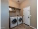 Convenient laundry room with washer, dryer, and storage at 744 E Laddoos Ave, Queen Creek, AZ 85140