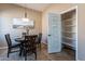 Breakfast nook with a built-in pantry and a dining table at 744 E Laddoos Ave, Queen Creek, AZ 85140