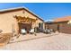 Relaxing patio with pergola, grill, and outdoor seating at 25223 W Parkside S Ln, Buckeye, AZ 85326