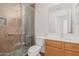 Clean bathroom, featuring a walk-in shower and wood vanity at 2268 S 162Nd Ln, Goodyear, AZ 85338