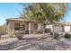 One-story house with tan exterior, stone accents, and a two-car garage at 2268 S 162Nd Ln, Goodyear, AZ 85338