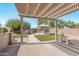 Landscaped backyard with pergola, gazebo and built-in grill at 2268 S 162Nd Ln, Goodyear, AZ 85338