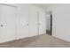 Bright bedroom with double closets and plush carpeting at 2268 S 162Nd Ln, Goodyear, AZ 85338