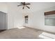 Spacious bedroom with ceiling fan and window coverings at 2268 S 162Nd Ln, Goodyear, AZ 85338