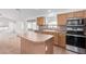 Island kitchen with stainless steel appliances and ample counter space at 2268 S 162Nd Ln, Goodyear, AZ 85338