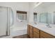 Double vanity bathroom with shower and bathtub at 2268 S 162Nd Ln, Goodyear, AZ 85338