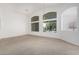 Bright dining room with vaulted ceiling, chandelier, and large windows at 2268 S 162Nd Ln, Goodyear, AZ 85338