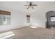 Bright bedroom featuring a ceiling fan and ensuite bathroom access at 2268 S 162Nd Ln, Goodyear, AZ 85338