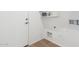 Convenient laundry room with built-in shelving at 2268 S 162Nd Ln, Goodyear, AZ 85338