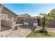 Backyard with storage shed and stone pathway at 2268 S 162Nd Ln, Goodyear, AZ 85338