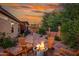 Backyard patio with fire pit and seating area at 6939 S Red Hills Rd, Gold Canyon, AZ 85118