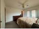 Spacious bedroom with ceiling fan, french doors, and carpeted floors at 3614 W Krall St, Phoenix, AZ 85019
