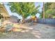 Large backyard with playground equipment and patio furniture, great for and entertaining at 945 E Missouri Ave, Phoenix, AZ 85014